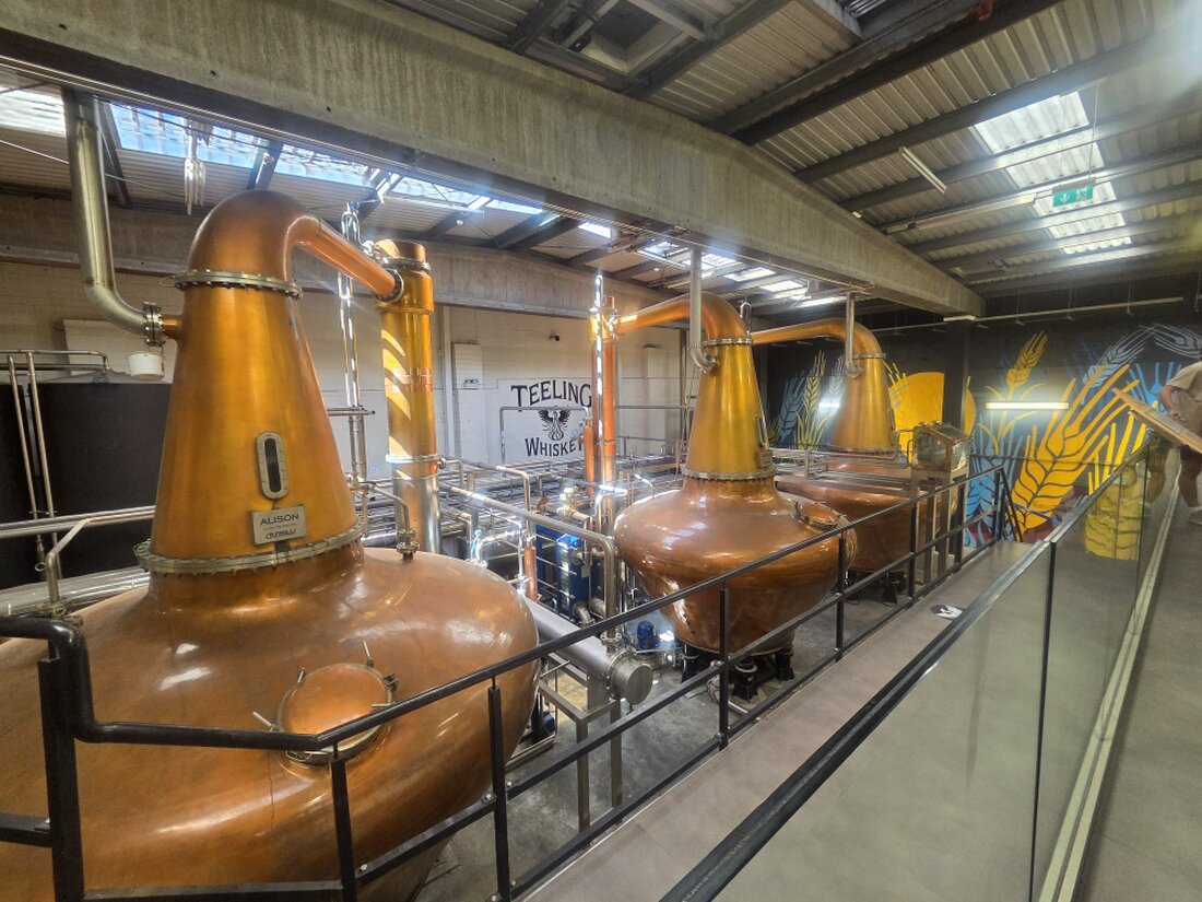 Whiskey glasses and an Irish castle backdrop