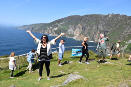 Hands planning an itinerary on a map
